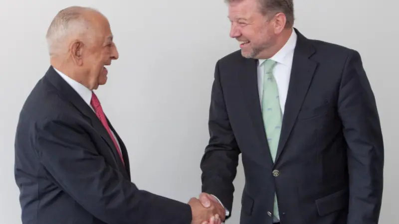 Dr Hermann J. Klein, IACS chairman (right), is obviously very happy to welcome IRS and its chairman, Captain J.C. Anand, to IACS
