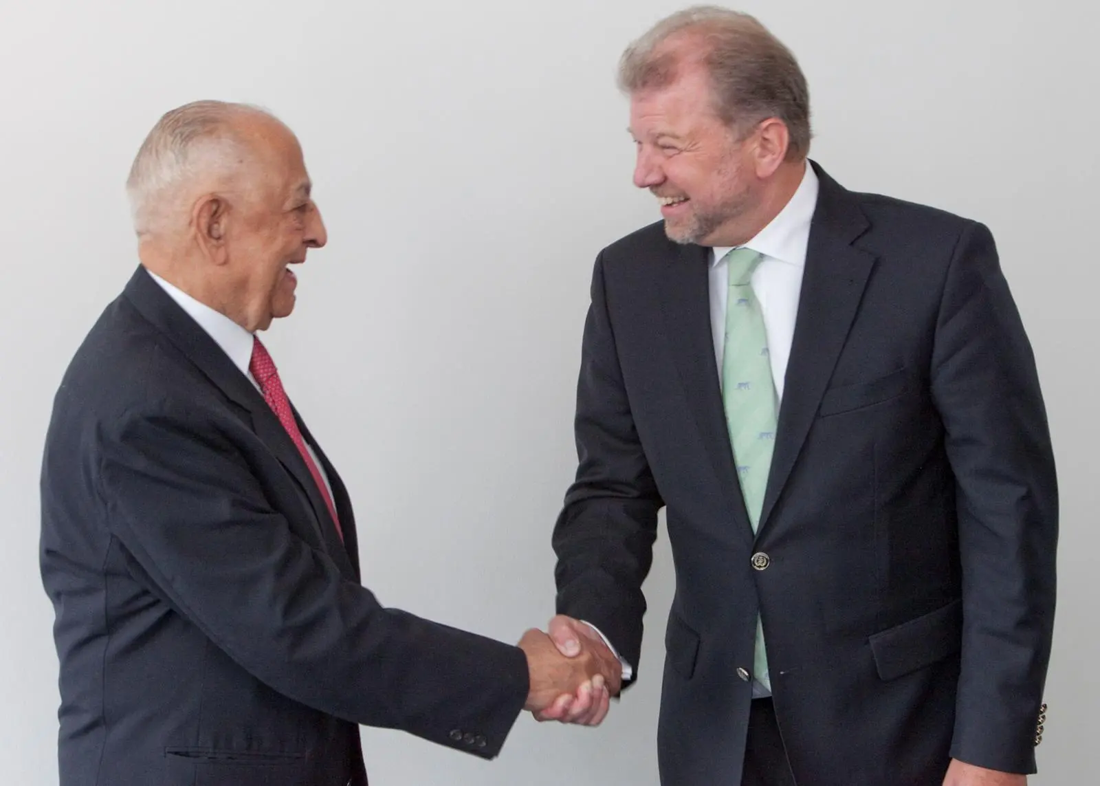 Dr Hermann J. Klein, IACS chairman (right), is obviously very happy to welcome IRS and its chairman, Captain J.C. Anand, to IACS