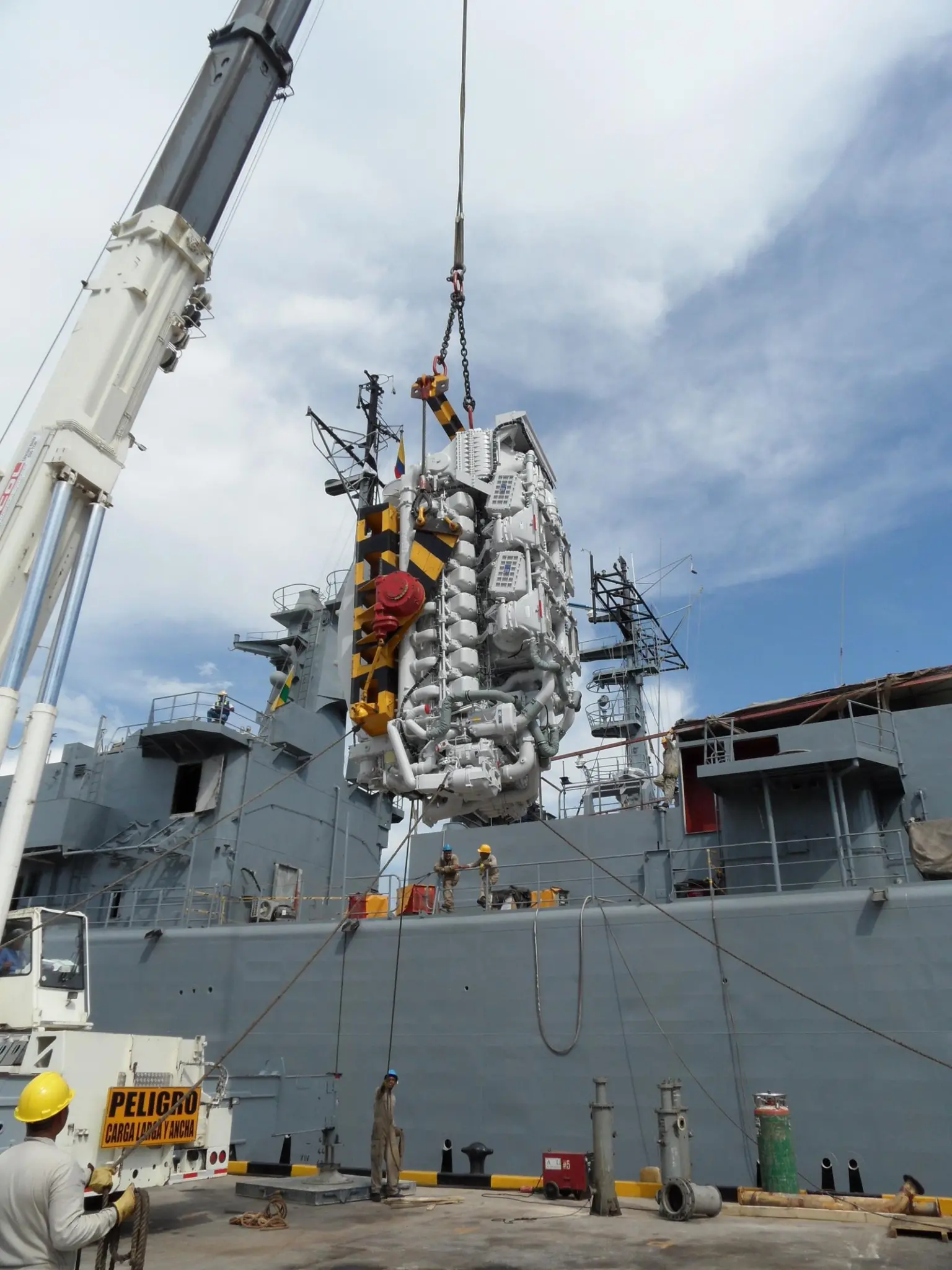One of the new MTU 1163 TB 73L is craned onboard a Colombian navy frigate