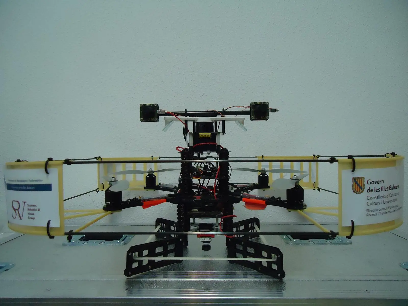 A small, remote-controlled, four-rotor helicopter is able to carry out overall surveys within cargo holds