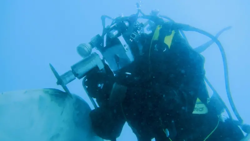 A Hydrex diver repairs a damaged propeller blade