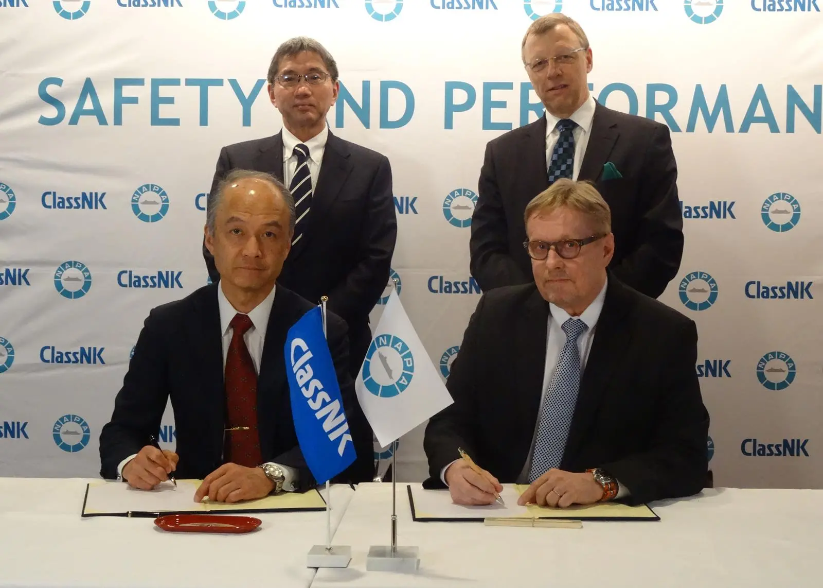 The acquisition of NAPA by Class NK is concluded byTetsuya Kinoshita, executive vice president, ClassNK (top left), Yasushi Nakamura, representative director, executive vice president, ClassNK (bottom left) Juha Heikinheimo, president, NAPA Grou...
