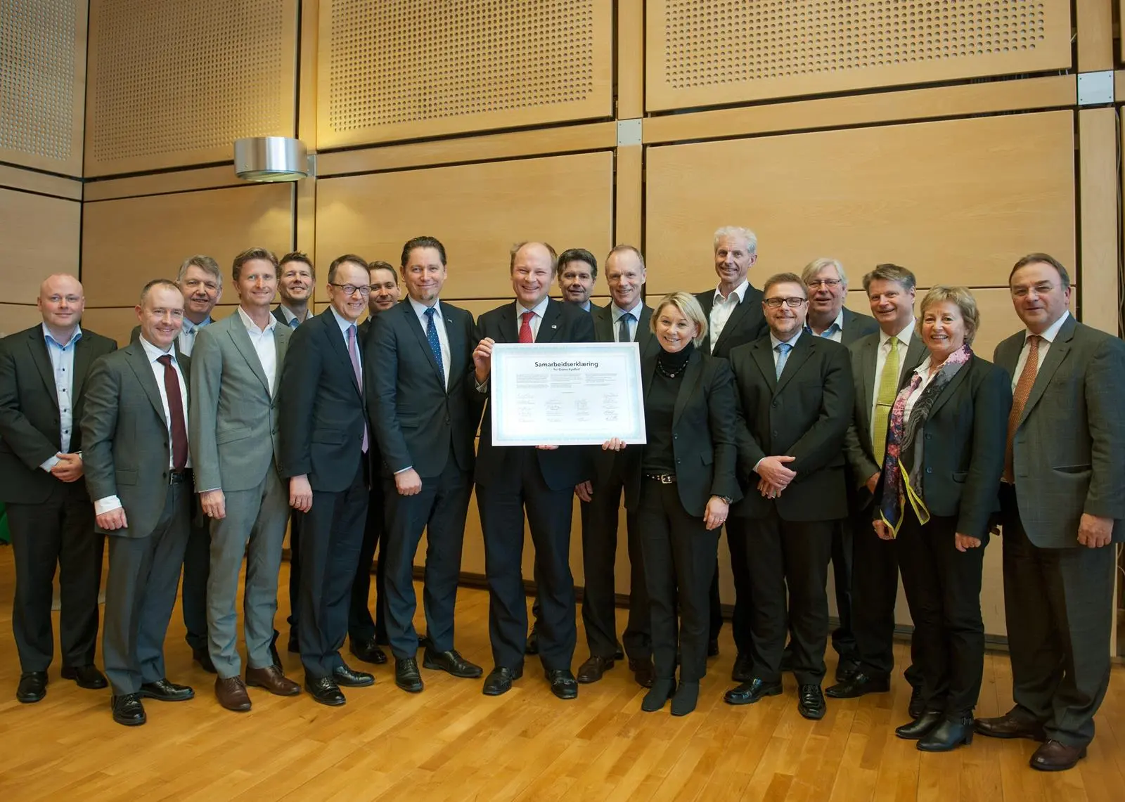Partners including Lars Andreas Lunde, Norwegian state secretary for climate and environment (holding the declaration), Monica Mæland, minister of trade and industry (right), and Remi Eriksen. deputy group chief executive DNV GL (left) signed a ...
