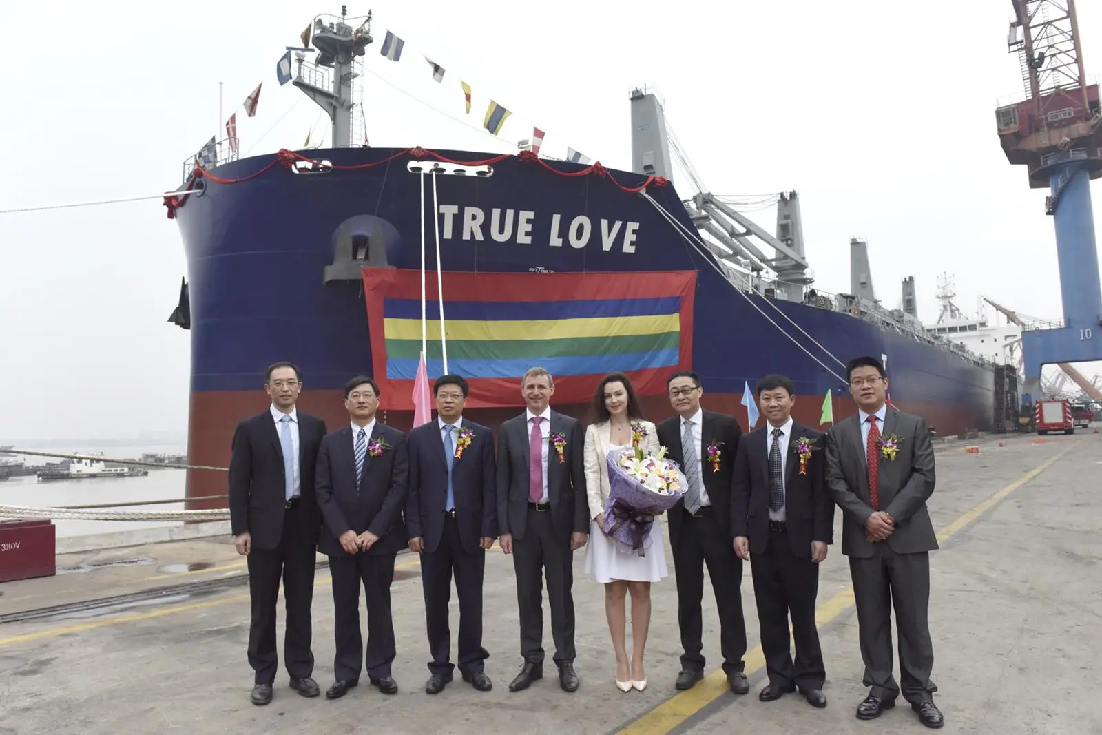 Dignitaries attend the naming ceremony of 'True Love', the first carrier of the Green Dolphin design