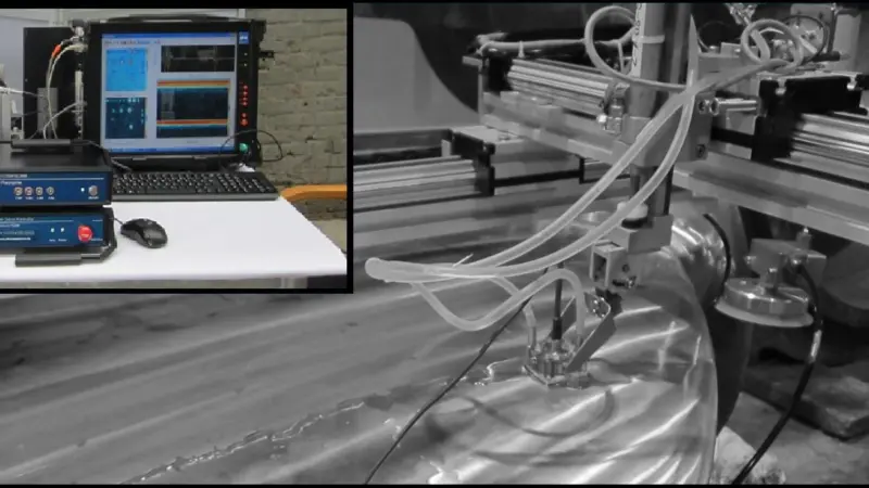 The automated ultrasonic system consists of a small lightweight measurement system which is used in conjunction with a mobile scanning device