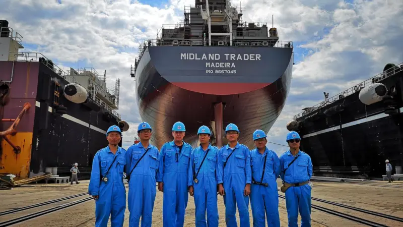Oldendorff's team in front of the new carrier, 'Midland Trader' Photo: Oldendorff