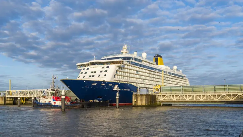 Spirit of Discovery making passage down the River Ems from her Papenburg yard of build (photo courtesy of Meyer Werft).