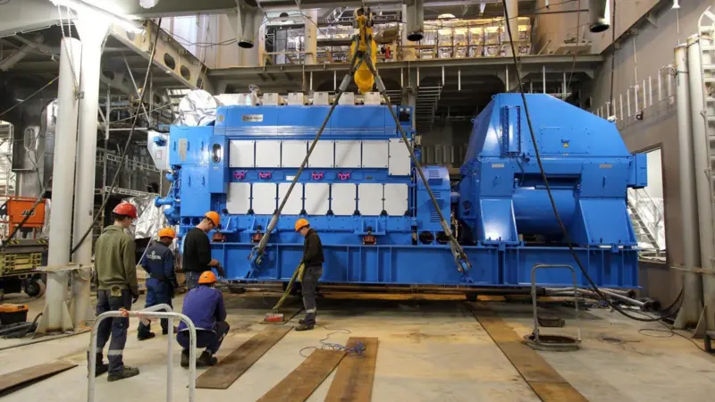 Installation of the third of the six main gensets on the newbuild at the Ulstein yard. (Credit: Ulstein Verft).