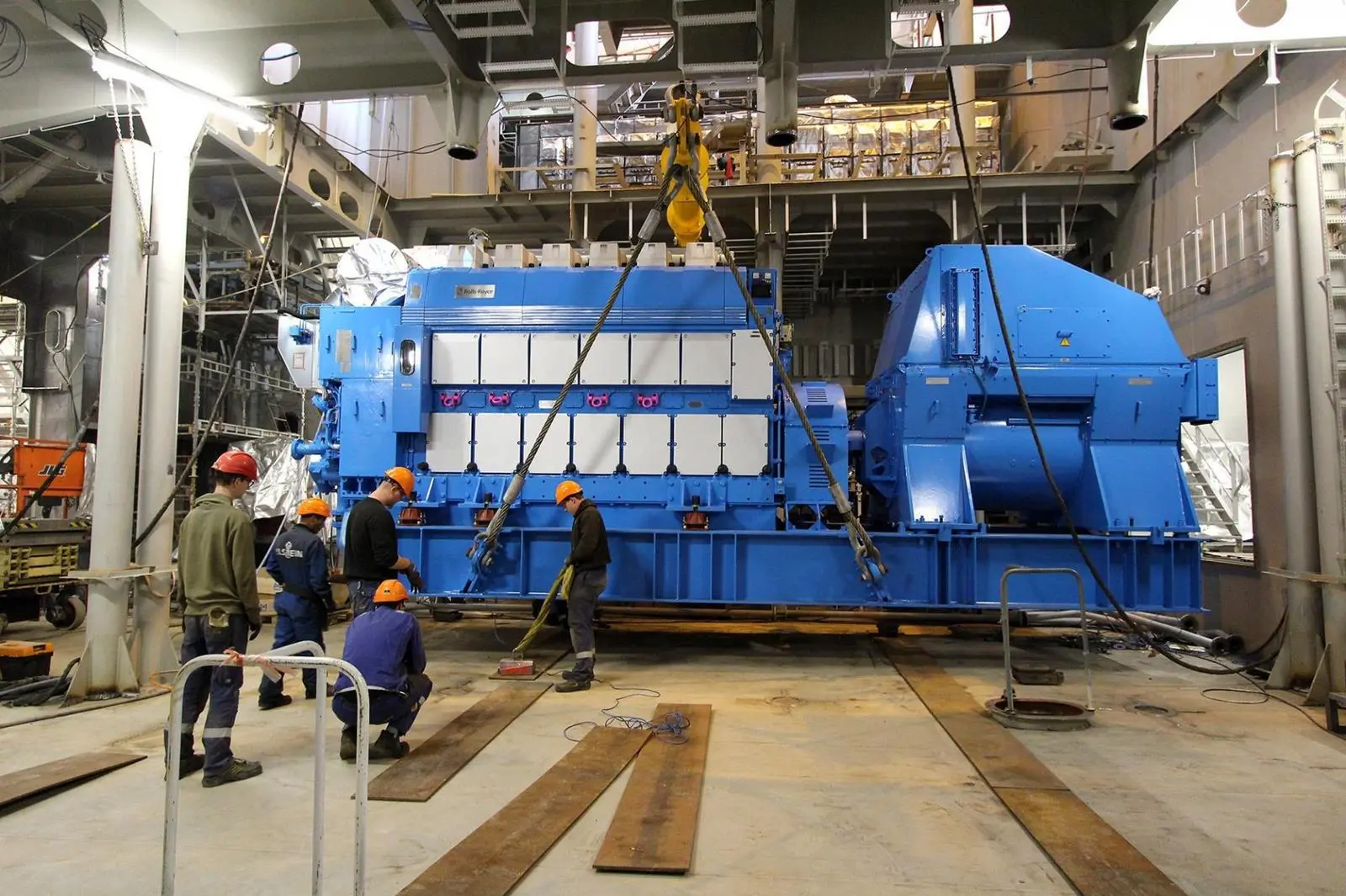 Installation of the third of the six main gensets on the newbuild at the Ulstein yard. (Credit: Ulstein Verft).