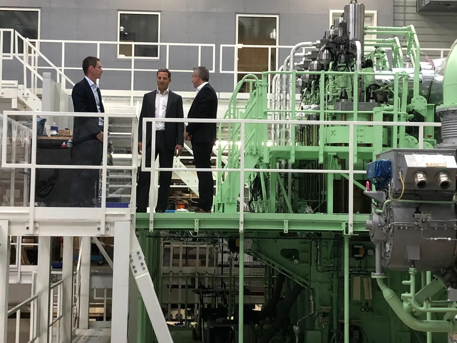 Trafigura's Rasmus Bach Nielsen, Global Head of Shipping Decarbonisation, and Jose Maria Larocca, Co-head of Oil Trading, visiting MAN Energy Solutions' test engine in Copenhagen with Brian Østergaard Sørensen, Vice President, Head of R&D Two-Stroke, earl