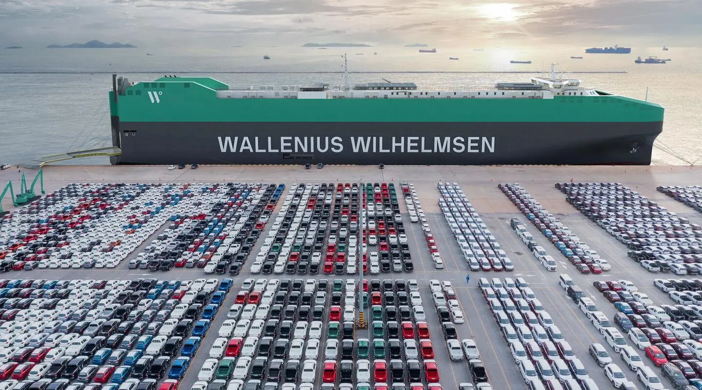 Wallenius Wilhelmsen PCTC at port with rows of cargo