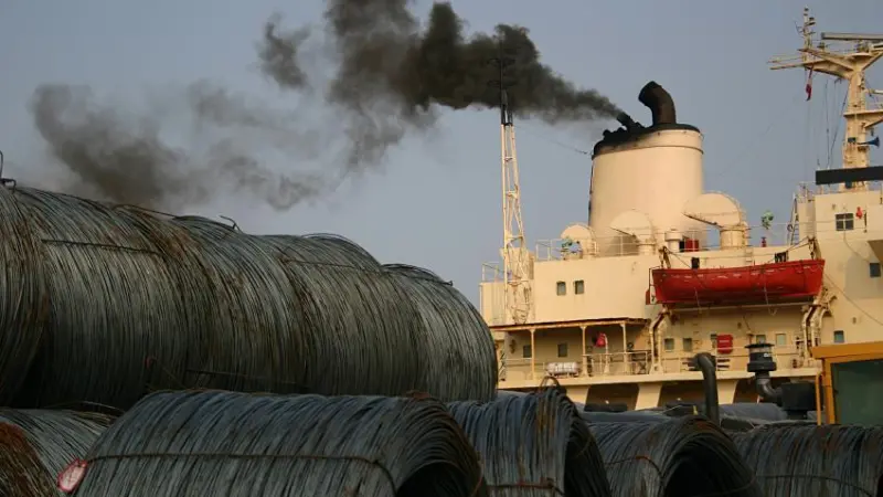 Ship producing emissions