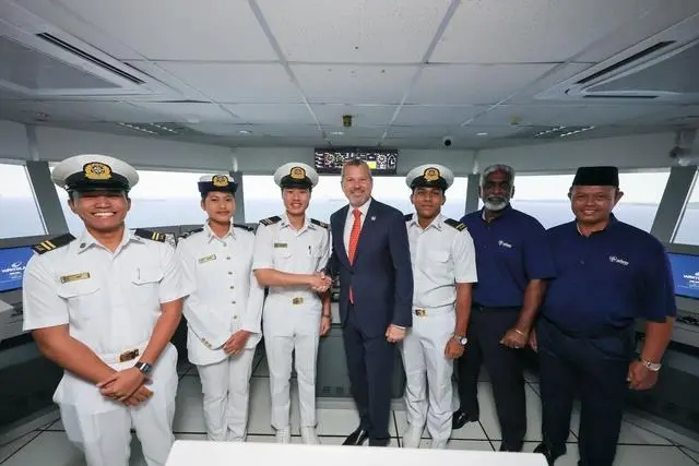 The image shows the inauguration of the Wärtsilä simulation suite at ALAM